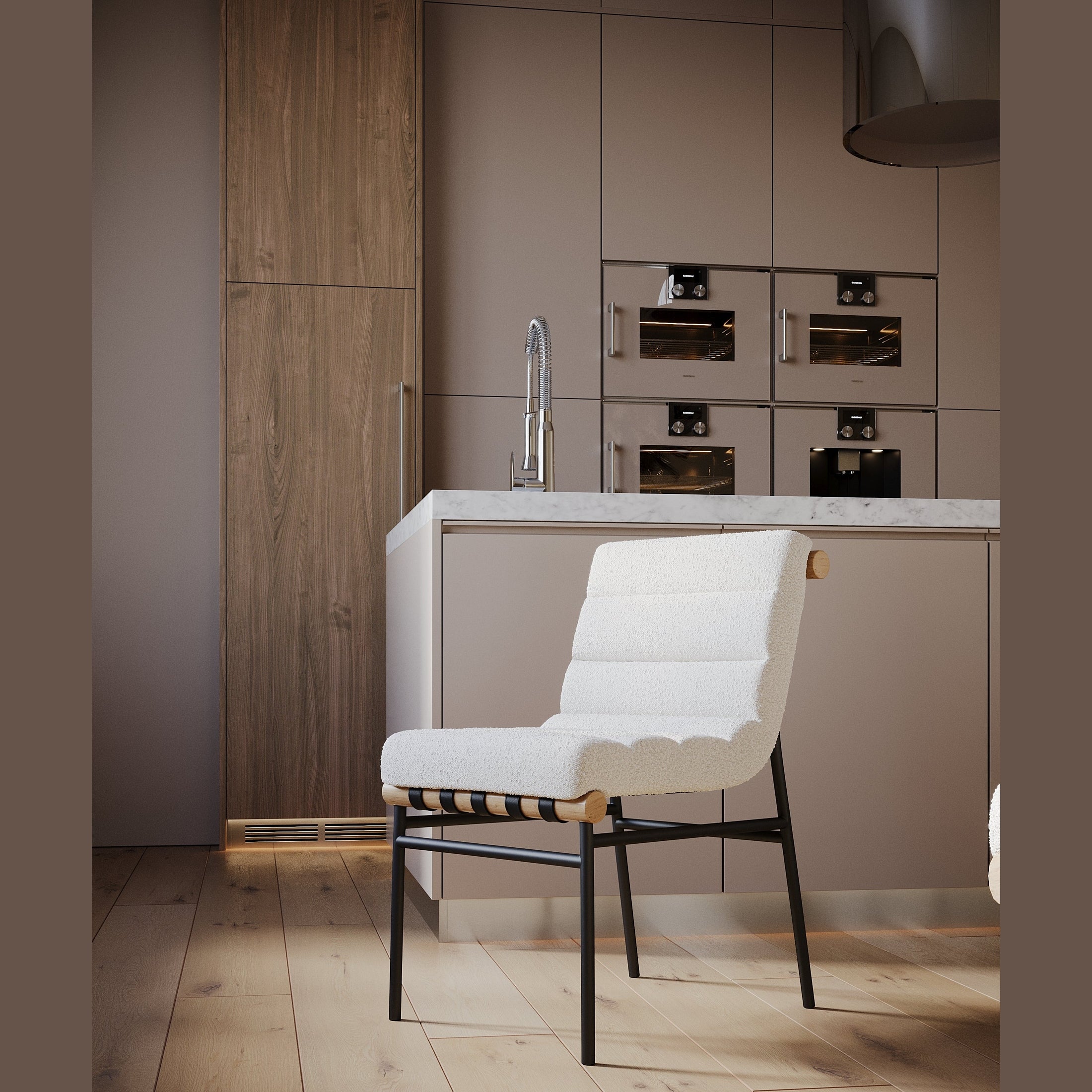 Modern accent chair with white upholstery and black legs in a stylish kitchen setting